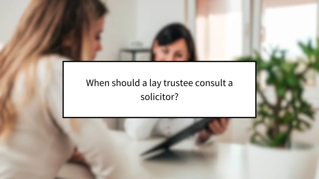 When should a lay trustee consult a solicitor?